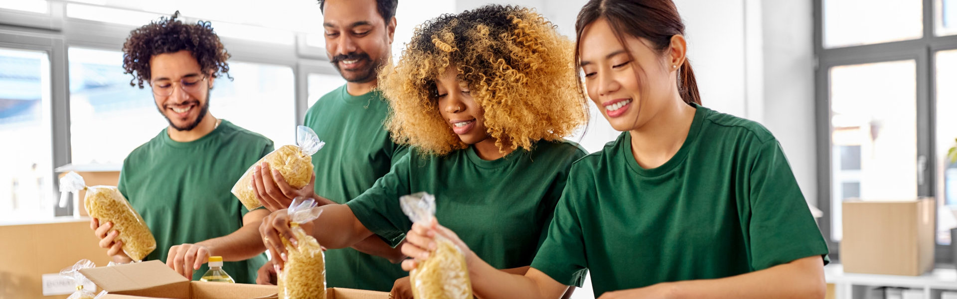 group of people holding plastic bag